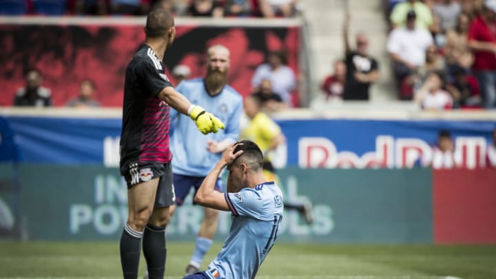 HARRISON, NJ – MAY 5 : Jesus Medina #19 of New York City falls to the ground in front of goalkeeper Luis Robles #31 of New York Red Bulls after missing the shot on goal during the New York Derby Major League Soccer match between New York City FC and New York Red Bulls at Red Bull Arena on May 5, 2018 in Harrison, NJ. New York Red Bulls won the match with a score of 4 to 0. (Photo by Ira L. Black/Corbis via Getty Images)