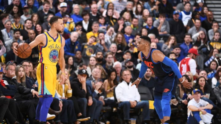 OAKLAND, CA - FEBRUARY 24: Stephen Curry #30 of the Golden State Warriors handles the ball against Russell Westbrook #0 of the Oklahoma City Thunder on February 24, 2018 at Oracle Arena in Oakland, California. NOTE TO USER: User expressly acknowledges and agrees that, by downloading and/or using this Photograph, user is consenting to the terms and conditions of the Getty Images License Agreement. Mandatory Copyright Notice: Copyright 2018 NBAE (Photo by Garrett W. Ellwood/NBAE via Getty Images)