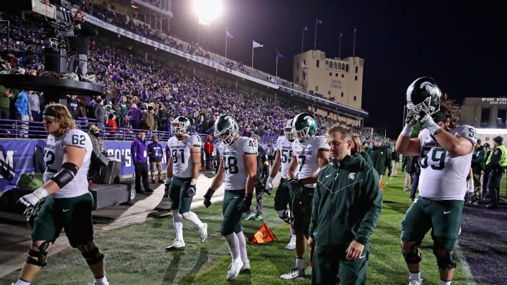 EVANSTON, IL – OCTOBER 28: Members of the Michigan State Spartans walk off of the field after a loss to the Northwestern Wildcats at Ryan Field on October 28, 2017 in Evanston, Illinois. Northwestern defeated Michigan State 39-31 in triple overtime.(Photo by Jonathan Daniel/Getty Images)