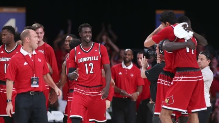 Nov 24, 2016; Paradise Island, BAHAMAS; Louisville Cardinals forward Mangok Mathiang (12) and teammates celebrate the victory against the Wichita State Shockers in the 2016 Battle 4 Atlantis in the Imperial Arena at the Atlantis Resort. Mandatory Credit: Kevin Jairaj-USA TODAY Sports