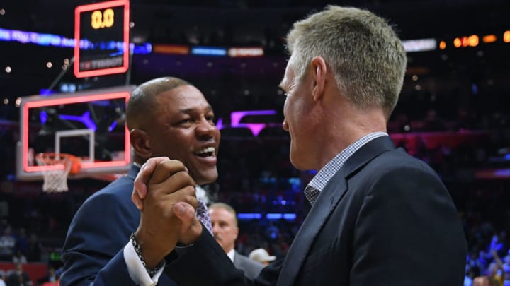 LOS ANGELES, CALIFORNIA - APRIL 26: Doc Rivers of the LA Clippers and Steve Kerr of the Golden State Warriors shake hands in a 129-110 Warrior win during Game Six of Round One of the 2019 NBA Playoffs at Staples Center on April 26, 2019 in Los Angeles, California. (Photo by Harry How/Getty Images) NOTE TO USER: User expressly acknowledges and agrees that, by downloading and or using this photograph, User is consenting to the terms and conditions of the Getty Images License Agreement.