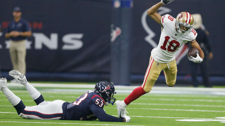 HOUSTON, TX – AUGUST 18: Dante Pettis #18 of the San Francisco 49ers is tripped up by Duke Ejiofor #53 of the Houston Texans as he runs with the ball after a reception in the first quarter during a preseason game at NRG Stadium on August 18, 2018 in Houston, Texas. (Photo by Bob Levey/Getty Images)
