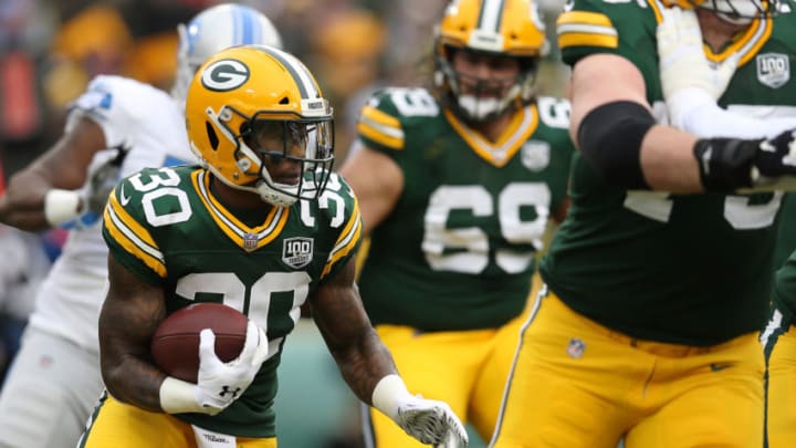 GREEN BAY, WISCONSIN - DECEMBER 30: Jamaal Williams #30 of the Green Bay Packers runs with the ball during the first half of a game against the Detroit Lions at Lambeau Field on December 30, 2018 in Green Bay, Wisconsin. (Photo by Dylan Buell/Getty Images)