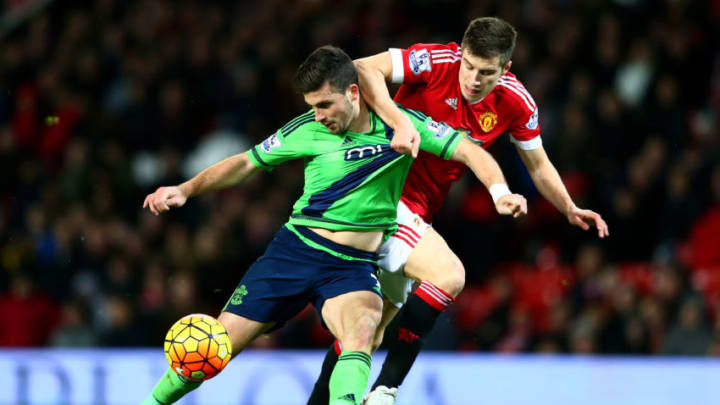 MANCHESTER, ENGLAND - JANUARY 23: Shane Long of Southampton and Morgan Schneiderlin of Manchester United compete for the ball during the Barclays Premier League match between Manchester United and Southampton at Old Trafford on January 23, 2016 in Manchester, England. (Photo by Michael Steele/Getty Images)