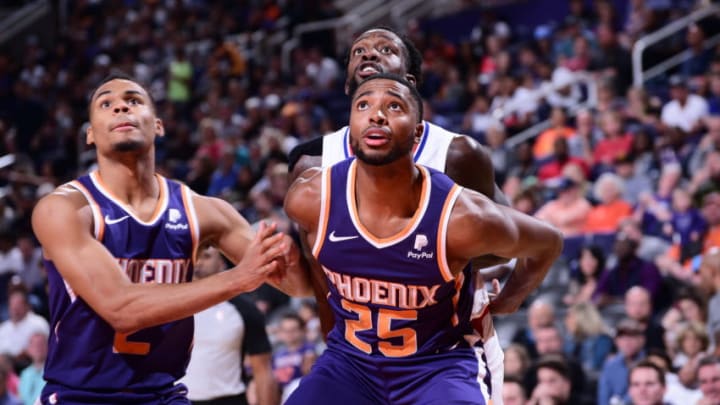 PHOENIX, AZ - OCTOBER 26: Mikal Bridges #25 of the Phoenix Suns and Patrick Beverley #21 of the LA Clippersfight for the rebound on October 26, 2019 at Talking Stick Resort Arena in Phoenix, Arizona. NOTE TO USER: User expressly acknowledges and agrees that, by downloading and or using this photograph, user is consenting to the terms and conditions of the Getty Images License Agreement. Mandatory Copyright Notice: Copyright 2019 NBAE (Photo by Michael Gonzales/NBAE via Getty Images)