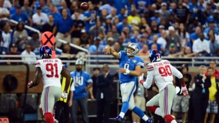 Sep 8, 2014; Detroit, MI, USA; Detroit Lions quarterback Matthew Stafford (9) throws a pass while being pressed by New York Giants defensive end Jason Pierre-Paul (90) during the first quarter at Ford Field. Mandatory Credit: Andrew Weber-USA TODAY Sports Sep 8, 2014; Detroit, MI, USA; Detroit Lions quarterback Matthew Stafford (9) throws a pass while being pressed by New York Giants defensive end Jason Pierre-Paul (90) during the first quarter at Ford Field. Mandatory Credit: Andrew Weber-USA TODAY Sports