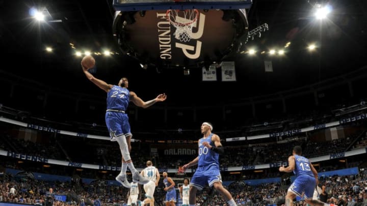 ORLANDO, FL - FEBRUARY 14: Khem Birch #24 of the Orlando Magic rebounds the ball against the Charlotte Hornets on February 14, 2019 at Amway Center in Orlando, Florida. NOTE TO USER: User expressly acknowledges and agrees that, by downloading and/or using this photograph, user is consenting to the terms and conditions of the Getty Images License Agreement. Mandatory Copyright Notice: Copyright 2019 NBAE (Photo by Fernando Medina/NBAE via Getty Images)