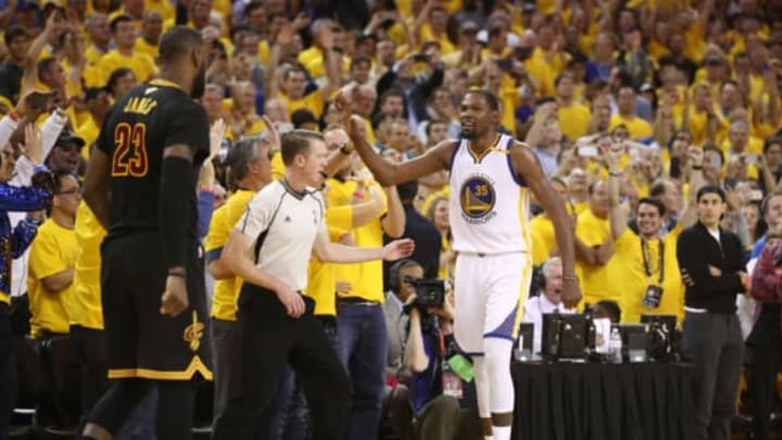 OAKLAND, CA – JUNE 12: LeBron James #23 of the Cleveland Cavaliers reacts as Kevin Durant #35 of the Golden State Warriors celebrates late in Game 5 of the 2017 NBA Finals at ORACLE Arena on June 12, 2017 in Oakland, California. NOTE TO USER: User expressly acknowledges and agrees that, by downloading and or using this photograph, User is consenting to the terms and conditions of the Getty Images License Agreement. (Photo by Ezra Shaw/Getty Images)