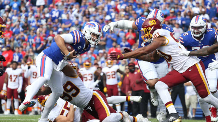 ORCHARD PARK, NEW YORK - SEPTEMBER 26: Chase Young #99 of the Washington Football Team hits quarterback Josh Allen #17 of the Buffalo Bills in the second quarter at Highmark Stadium on September 26, 2021 in Orchard Park, New York. (Photo by Joshua Bessex/Getty Images)