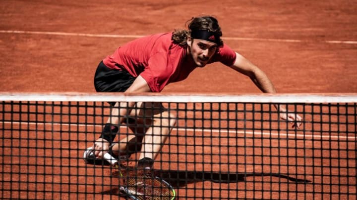 TOPSHOT - Greece's Stefanos Tsitsipas returns the ball to Italy's Lorenzo Musetti during their ATP 250 Lyon Open Parc tennis tournament semi-final match on May 22, 2021. (Photo by JEFF PACHOUD / AFP) (Photo by JEFF PACHOUD/AFP via Getty Images)
