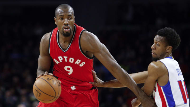 Apr 5, 2017; Auburn Hills, MI, USA; Toronto Raptors forward Serge Ibaka (9) dribbles the ball as Detroit Pistons guard Ish Smith (14) defendsduring the first quarter at The Palace of Auburn Hills. Mandatory Credit: Raj Mehta-USA TODAY Sports