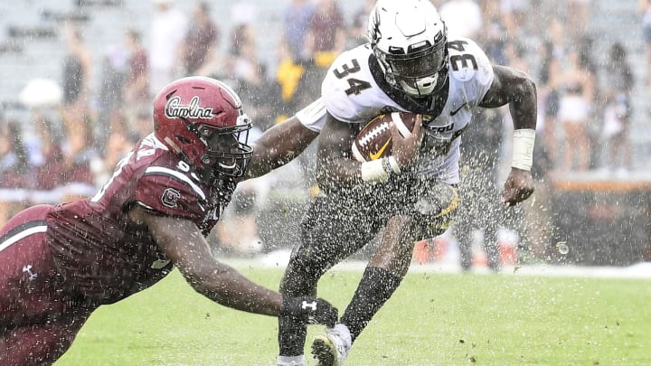COLUMBIA, SC – OCTOBER 06: Running back Larry Rountree III #34 of the Missouri Tigers evades defensive lineman Rick Sandidge #90 of the South Carolina Gamecocks during the football game at Williams-Brice Stadium on October 6, 2018 in Columbia, South Carolina. (Photo by Mike Comer/Getty Images)