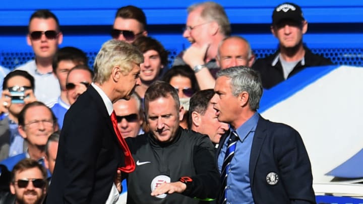 LONDON, ENGLAND - OCTOBER 05: Fourth Official Jonathan Moss comes between Managers Arsene Wenger of Arsenal and Jose Mourinho manager of Chelsea during the Barclays Premier League match between Chelsea and Arsenal at Stamford Bridge on October 4, 2014 in London, England. (Photo by Shaun Botterill/Getty Images)