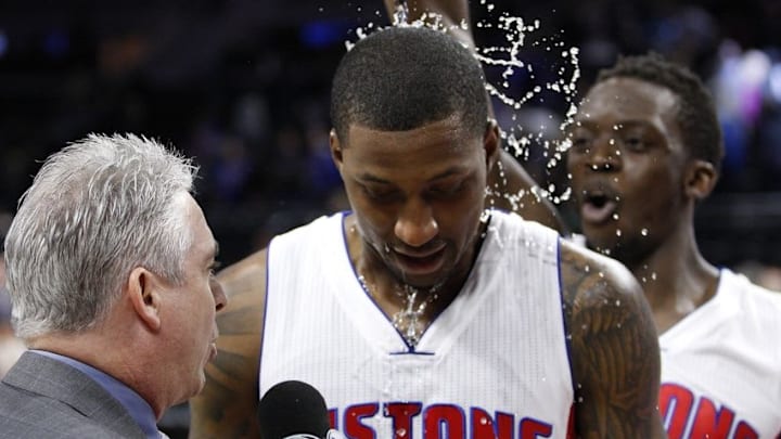 Mar 25, 2016; Auburn Hills, MI, USA; Detroit Pistons guard Reggie Jackson (R) pours water on guard Kentavious Caldwell-Pope (5) after their game against the Charlotte Hornets at The Palace of Auburn Hills. The Pistons won 112-105. Mandatory Credit: Raj Mehta-USA TODAY Sports