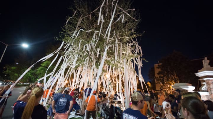 AUBURN, AL – SEPTEMBER 10: Fans of the Auburn Tigers roll trees at Toomer’s Corner after defeating the Arkansas State Red Wolves at Jordan Hare Stadium on September 10, 2016 in Auburn, Alabama. The Auburn Tigers defeated the Arkansas State Red Wolves 51-14.(Photo by Michael Chang/Getty Images)