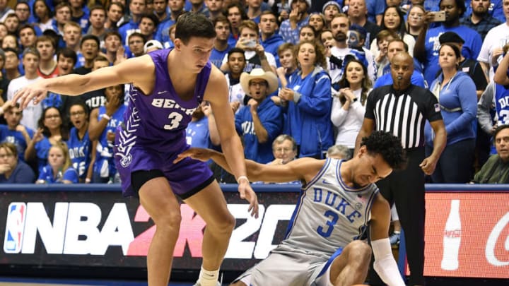 DURHAM, NORTH CAROLINA - NOVEMBER 12: Tre Jones #3 of the Duke Blue Devils collides with Aaron Weidenaar #3 of the Central Arkansas Bears during the first half of their game at Cameron Indoor Stadium on November 12, 2019 in Durham, North Carolina. (Photo by Grant Halverson/Getty Images)
