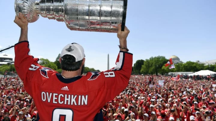 WASHINGTON, DC – JUNE 12: Alex Ovechkin #8 of the Washington Capitals holds the Stanley Cup during the Washington Capitals Victory Parade And Rally on June 12, 2018 in Washington, DC. (Photo by Patrick McDermott/NHLI via Getty Images)