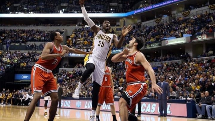 Nov 15, 2013; Indianapolis, IN, USA; Indiana Pacers center Roy Hibbert (55) takes a shot against Milwaukee Bucks center Zaza Pachulia (27) at Bankers Life Fieldhouse. Indiana defeats Milwaukee 104-77. Mandatory Credit: Brian Spurlock-USA TODAY Sports