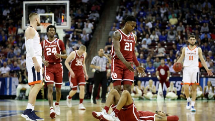 COLUMBIA, SOUTH CAROLINA - MARCH 24: Miles Reynolds #3 of the Oklahoma Sooners lays on the ground after a play against the Virginia Cavaliers during the first half in the second round game of the 2019 NCAA Men's Basketball Tournament at Colonial Life Arena on March 24, 2019 in Columbia, South Carolina. (Photo by Streeter Lecka/Getty Images)
