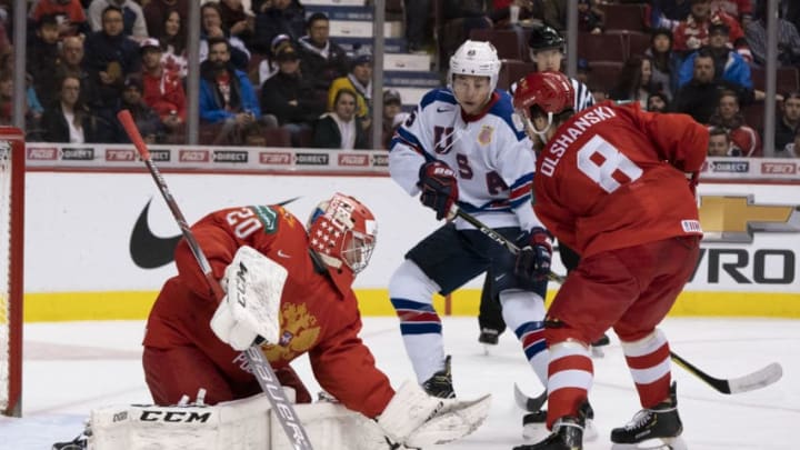 VANCOUVER, BC - JANUARY 4: Goalie Pyotr Kochetkov #20 of Russia makes a save as Jason Robertson #15 of the United States and Saveli Olshanski #8 of Russia battle in front of the goal in Semifinals hockey action of the 2019 IIHF World Junior Championship on January, 4, 2019 at Rogers Arena in Vancouver, British Columbia, Canada. (Photo by Rich Lam/Getty Images)