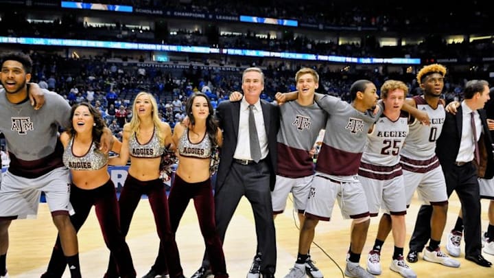 Mar 12, 2016; Nashville, TN, USA; (Editors note: Caption correction) Texas A&M Aggies assistant coach Rick Stansbury celebrates with team members and cheerleaders after defeating the LSU Tigers during the second half of game ten of the SEC tournament at Bridgestone Arena. Texas A&M won 71-38. Mandatory Credit: Jim Brown-USA TODAY Sports