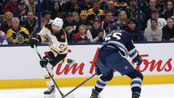 Oct 28, 2022; Columbus, Ohio, USA; Boston Bruins left wing Nick Foligno (17) shoots against Columbus Blue Jackets defenseman David Jiricek (55) during the first period at Nationwide Arena. Mandatory Credit: Russell LaBounty-USA TODAY Sports