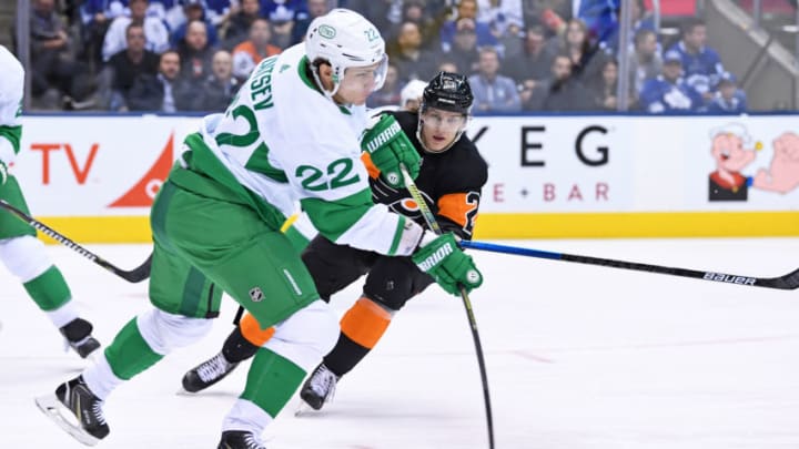 TORONTO, ON - MARCH 15: Toronto Maple Leafs Defenceman Nikita Zaitsev (22) clears the puck in front of Philadelphia Flyers Left Wing Oskar Lindblom (23) during the regular season NHL game between the Philadelphia Flyers and Toronto Maple Leafs on March 15, 2019 at Scotiabank Arena in Toronto, ON. (Photo by Gerry Angus/Icon Sportswire via Getty Images)