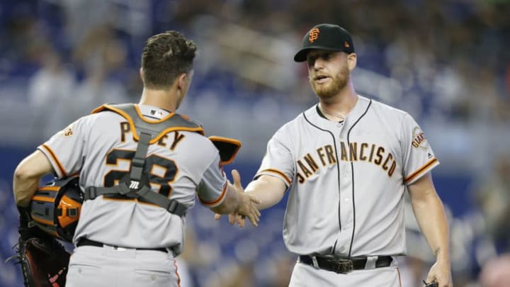 MIAMI, FLORIDA - MAY 30: Will Smith #13 of the San Francisco Giants celebates with Buster Posey #28 after defeating the Miami Marlins 3-1 at Marlins Park on May 30, 2019 in Miami, Florida. (Photo by Michael Reaves/Getty Images)