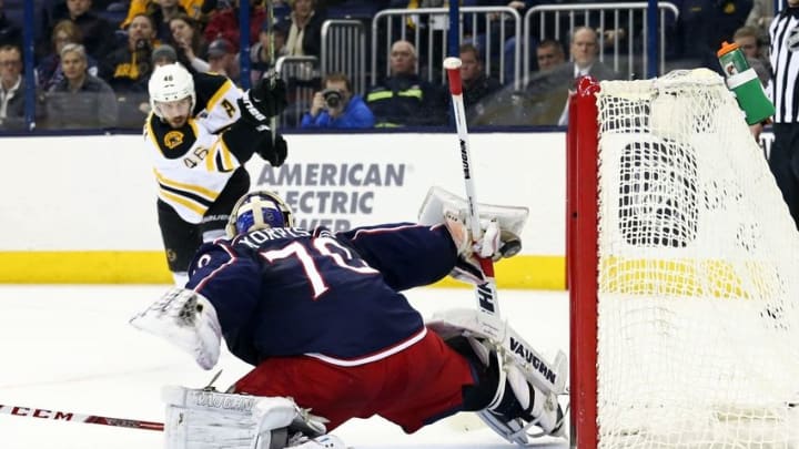 Feb 16, 2016; Columbus, OH, USA; Columbus Blue Jackets goalie Joonas Korpisalo (70) makes a glove save on a shot from Boston Bruins center David Krejci (46) in the first period at Nationwide Arena. Mandatory Credit: Aaron Doster-USA TODAY Sports