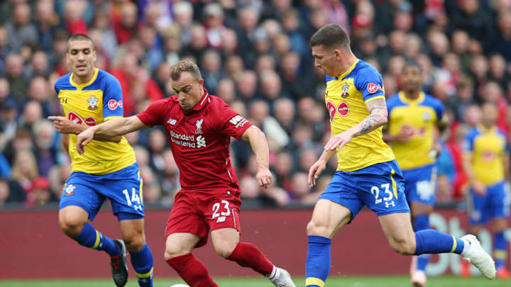 LIVERPOOL, ENGLAND - SEPTEMBER 22: Xherdan Shaqiri of Liverpool is challenged by Pierre-Emile Hojbjerg of Southampton during the Premier League match between Liverpool FC and Southampton FC at Anfield on September 22, 2018 in Liverpool, United Kingdom. (Photo by Alex Livesey/Getty Images)