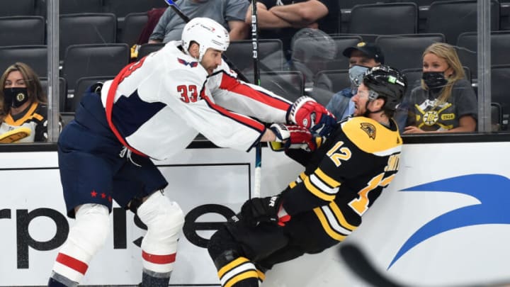 May 21, 2021; Boston, Massachusetts, USA; Washington Capitals defenseman Zdeno Chara (33) knocks down Boston Bruins right wing Craig Smith (12) during the first period in game four of the first round of the 2021 Stanley Cup Playoffs at TD Garden. Mandatory Credit: Bob DeChiara-USA TODAY Sports