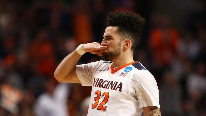 Mar 27, 2016; Chicago, IL, USA; Virginia Cavaliers guard London Perrantes (32) reacts after making a three-point shot against the Syracuse Orange during the first half in the championship game of the midwest regional of the NCAA Tournament at the United Center. Mandatory Credit: Dennis Wierzbicki-USA TODAY Sports