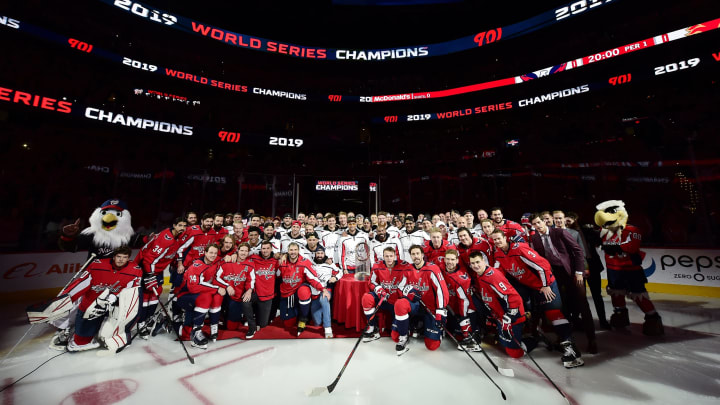 WASHINGTON, DC – NOVEMBER 03: The Washington Capitals and Washington Nationals pose for a photo after the Nationals were honored during a pregame ceremony to celebrate the Washington Nationals World Series victory at Capital One Arena on November 3, 2019 in Washington, DC. (Photo by Patrick McDermott/NHLI via Getty Images)