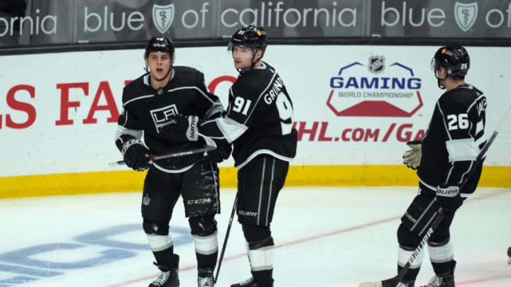 Apr 20, 2021; Los Angeles, California, USA; LA Kings center Blake Lizotte (46) celebrates with left wing Carl Grundstrom (91) and defenseman Sean Walker (26) after scoring a goal against the Anaheim Ducks in the third period at Staples Center. Mandatory Credit: Kirby Lee-USA TODAY Sports