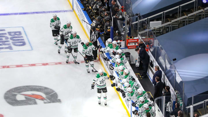 John Klingberg #3 of the Dallas Stars is congratulated by his teammates after scoring a goal against the Vegas Golden Knights