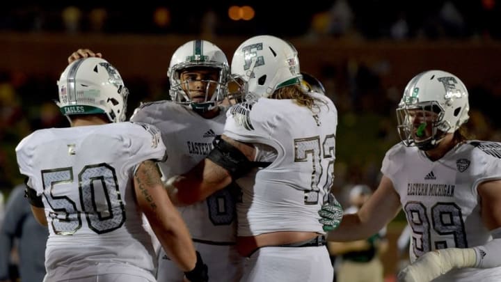 Sep 10, 2016; Columbia, MO, USA; Eastern Michigan Eagles quarterback Todd Porter (8) is congratulated by team mates after scoring during the second half against the Missouri Tigers at Faurot Field. Missouri won 61-21. Mandatory Credit: Denny Medley-USA TODAY Sports