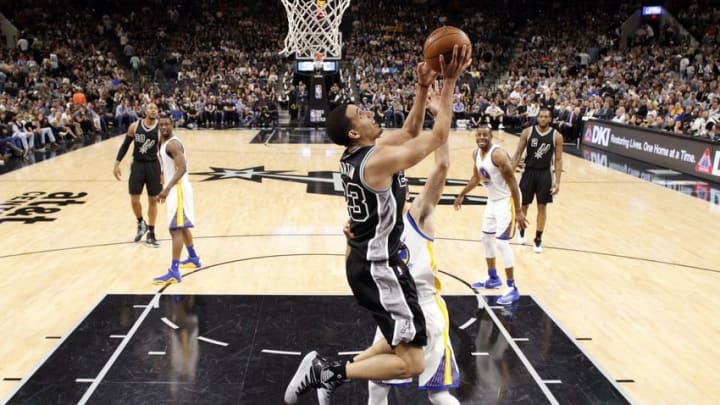 Apr 10, 2016; San Antonio, TX, USA; San Antonio Spurs guard Kevin Martin (23) shoots the ball as Golden State Warriors point guard Stephen Curry (30, behind) defends during the second half at AT&T Center. Mandatory Credit: Soobum Im-USA TODAY Sports