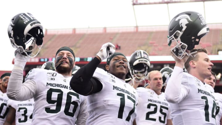 Michigan State football players sing their alma mater (Photo by Emilee Chinn/Getty Images)