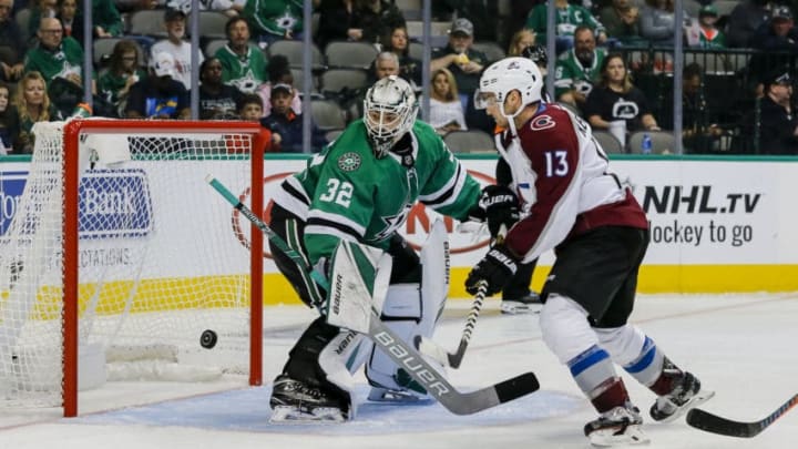 DALLAS, TX - SEPTEMBER 30: Dallas Stars goalie Colton Point (32) defends his net against Colorado Avalanche center Alexander Kerfoot (13) during the game between the Dallas Stars and the Colorado Avalanche on September 30, 2018 at the American Airlines Center in Dallas, Texas. Colorado defeats Dallas 6-5. (Photo by Matthew Pearce/Icon Sportswire via Getty Images)