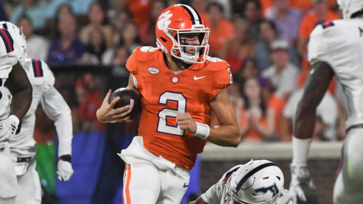 Sep 16, 2023; Clemson, South Carolina; Clemson quarterback Cade Klubnik (2) runs near Florida Atlantic linebacker Eddie Williams (3) during the first quarter against Florida Atlantic at Memorial Stadium. Mandatory Credit: Ken Ruinard-USA TODAY NETWORK