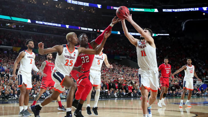 MINNEAPOLIS, MINNESOTA – APRIL 08: Mamadi Diakite #25 and Ty Jerome #11 of the Virginia Cavaliers battles for the ball with Norense Odiase #32 of the Texas Tech Red Raiders in the second half during the 2019 NCAA men’s Final Four National Championship game at U.S. Bank Stadium on April 08, 2019 in Minneapolis, Minnesota. (Photo by Tom Pennington/Getty Images)