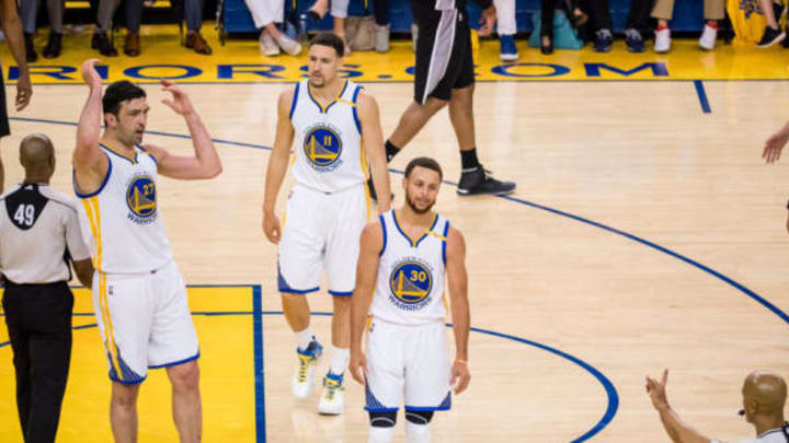 May 14, 2017; Oakland, CA, USA; Golden State Warriors center Zaza Pachulia (27), guard Klay Thompson (11) and guard Stephen Curry (30) react after a call against the San Antonio Spurs during the second quarter in game one of the Western conference finals of the 2017 NBA Playoffs at Oracle Arena. Mandatory Credit: Kelley L Cox-USA TODAY Sports