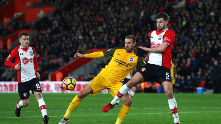 SOUTHAMPTON, ENGLAND - JANUARY 31: Glenn Murray of Brighton and Hove Albion is tackled by Jack Stephens of Southampton during the Premier League match between Southampton and Brighton and Hove Albion at St Mary's Stadium on January 31, 2018 in Southampton, England. (Photo by Michael Steele/Getty Images)
