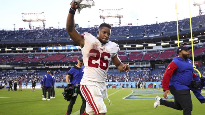 NASHVILLE, FL - SEPTEMBER 11: Saquon Barkley #26 of the New York Giants celebrates after beating the Tennessee Titans in an NFL football game at Nissan Stadium on September 11, 2022 in Nashville, Tennessee. (Photo by Kevin Sabitus/Getty Images)