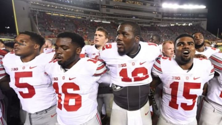 Sep 7, 2015; Blacksburg, VA, USA; Ohio State Buckeyes linebacker Raekwon McMillan (5) and quarterback J.T. Barrett (16) and quarterback Cardale Jones (12) and running back Ezekiel Elliott (15) after the game. The Ohio State Buckeyes defeated the Virginia Tech Hokies 42-24 at Lane Stadium. Mandatory Credit: Bob Donnan-USA TODAY Sports