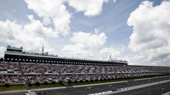 LONG POND, PA - JULY 7: Drivers race during the Pocono INDYCAR 400 at Pocono Raceway on July 7, 2013 in Long Pond, Pennsylvania. (Photo by Jeff Zelevansky/Getty Images)