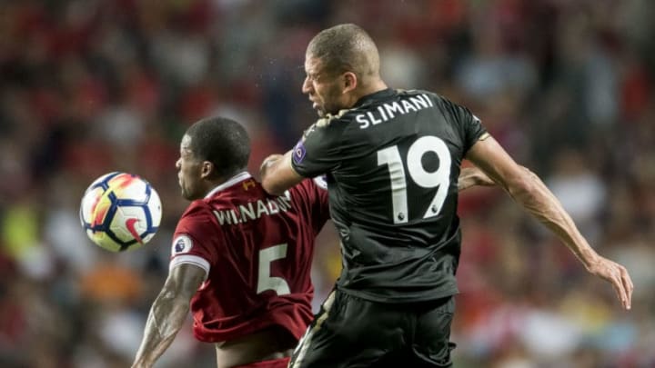 HONG KONG, HONG KONG - JULY 22: Leicester City FC forward Islam Slimani (R) competes for the ball with Liverpool FC midfielder Georginio Wijnaldum (L) during the Premier League Asia Trophy match between Liverpool FC and Leicester City FC at Hong Kong Stadium on July 22, 2017 in Hong Kong, Hong Kong. (Photo by Victor Fraile/Getty Images )