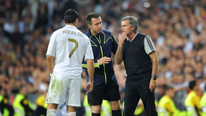 MADRID, SPAIN – OCTOBER 18: Head coach Jose Mourinho (R) of Real Madrid instructs Cristiano Ronaldo during the UEFA Champions League group D match between Real Madrid and Olympique Lyonnais at the Estadio Santiago Bernabeu on October 18, 2011 in Madrid, Spain. (Photo by Jasper Juinen/Getty Images)