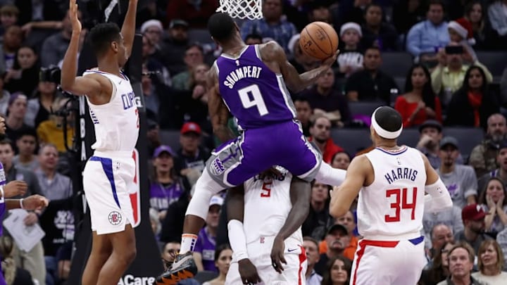 SACRAMENTO, CA - NOVEMBER 29: Iman Shumpert #9 of the Sacramento Kings goes up for a shot against Montrezl Harrell #5, Shai Gilgeous-Alexander #2, and Tobias Harris #34 of the LA Clippers at Golden 1 Center on November 29, 2018 in Sacramento, California. NOTE TO USER: User expressly acknowledges and agrees that, by downloading and or using this photograph, User is consenting to the terms and conditions of the Getty Images License Agreement. (Photo by Ezra Shaw/Getty Images)