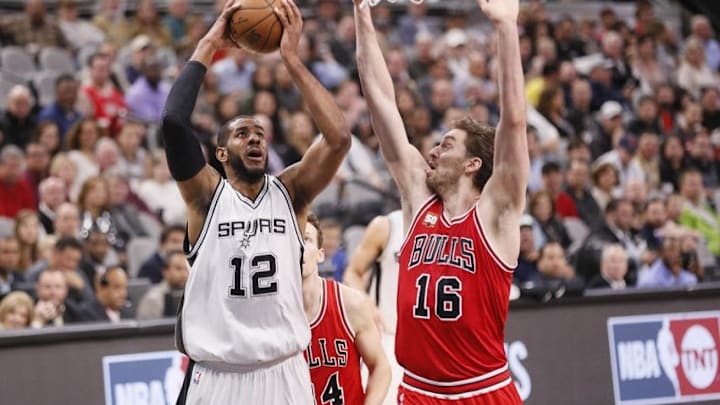 Mar 10, 2016; San Antonio, TX, USA; San Antonio Spurs power forward LaMarcus Aldridge (12) shoots the ball as Chicago Bulls center Pau Gasol (16) defends during the first half at AT&T Center. Mandatory Credit: Soobum Im-USA TODAY Sports